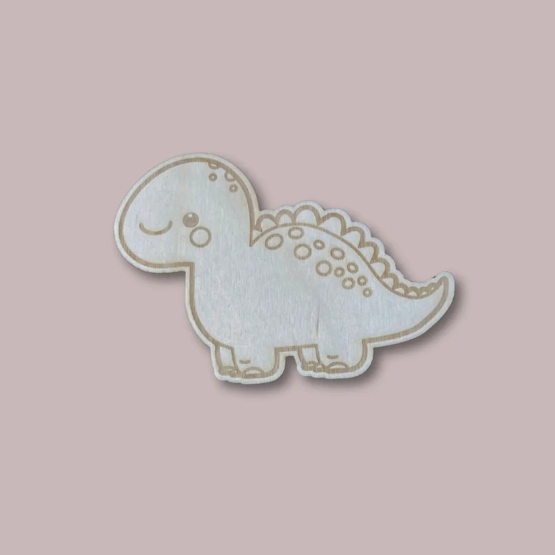 Puinen dinosaurus lastenhuoneen oveen lapsen nimellä.