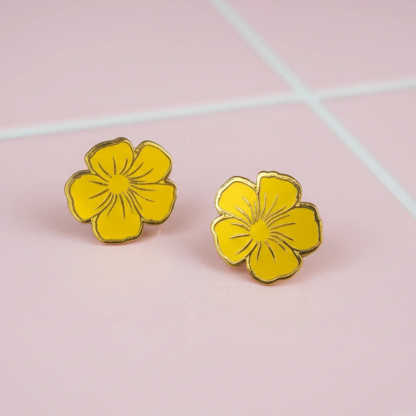 Kultainen orvokki korvakoru.