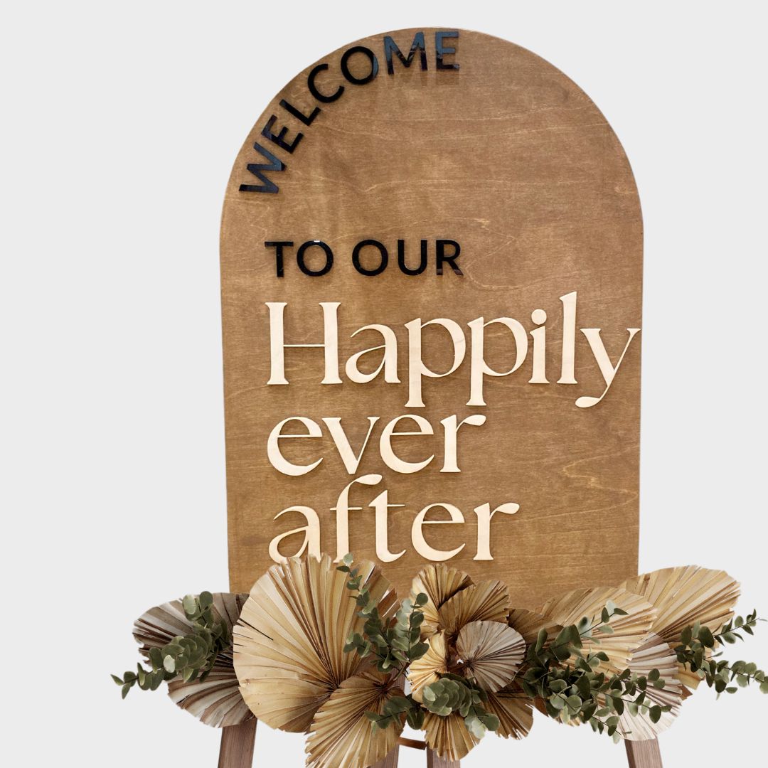 Puinen tervetuloa-kyltti häihin