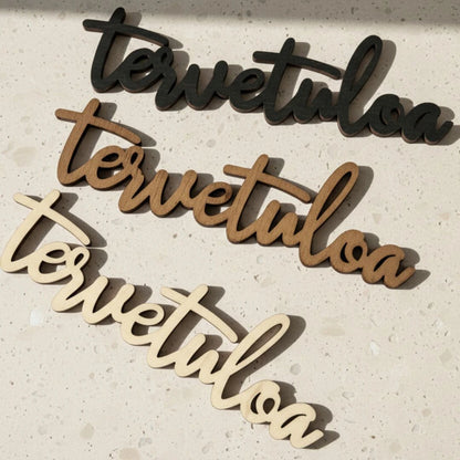 Tervetuloa-kyltti sisätiloihin